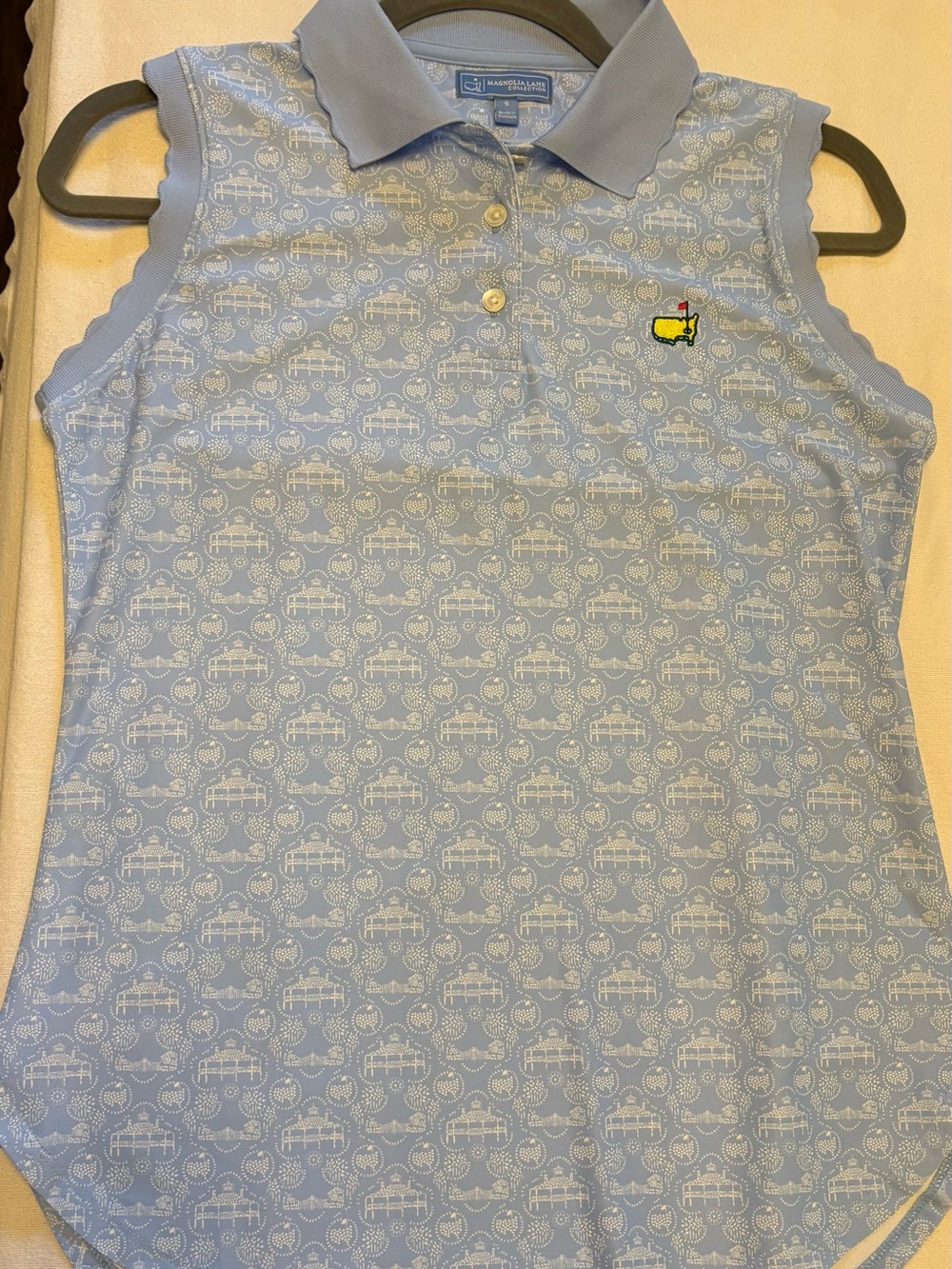 Magnolia Girls Light Blue Sleeveless Polo with Yellow Logo